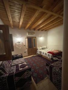 a large room with two beds and a rug at Dream house dahab in Dahab