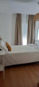 Кровать или кровати в номере Casa da Praia - Manta Rota