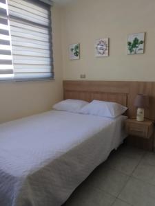 Ένα ή περισσότερα κρεβάτια σε δωμάτιο στο Posada del sol