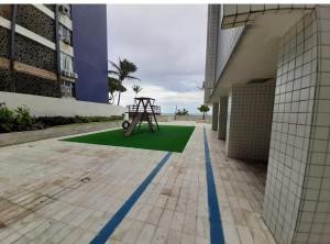 a playground in the middle of a building at Apartamento em Boa Viagem in Recife