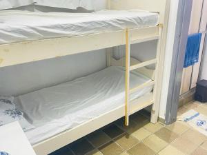 a couple of bunk beds in a room at Apartamento em Boa Viagem in Recife