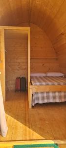 a room with two beds in a wooden cabin at Agriturismo Il Macereto in Fivizzano