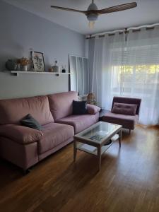 a living room with a couch and a coffee table at Piso acogedor con terraza in Ciudad Real