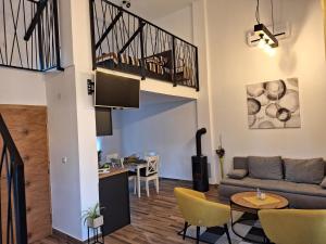 a living room with a couch and a table at Kuća za odmor Sweet Home in Vukovar