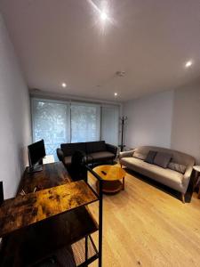 a living room with a couch and a table at London Southwark Zone 1 Apt by Sandstone Investment in London
