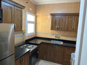 Kuchyň nebo kuchyňský kout v ubytování Al Rehab City,,, avenue Mall Group129 bulding7 5thCASA MIA