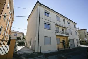 a white building with a fence in front of it at Venice Residence Elisabeth in Mestre