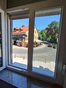 an open window with a view of a street at Astralis Factory Apartments- Mars & Venus in Zagreb