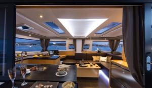 an open living room and kitchen on a yacht at Placencia Sailing Catamaran Day Charter « Gingembre » in Placencia