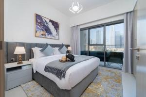 Postel nebo postele na pokoji v ubytování Vogue Downtown - Burj Royale - Spectacular Burj Khalifa & Dubai Mall View