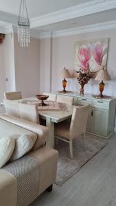 a dining room with a table and chairs at VILLA KOHLER in Alanya