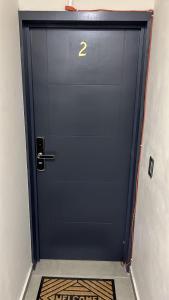 a blue door with the number two on it at SaVilie 2 - Seguridad y Comfort in Guadalajara