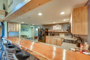 a kitchen with a large wooden counter top at Spacious Old Forge Condo w/ Patio & Fire Pit! in Old Forge