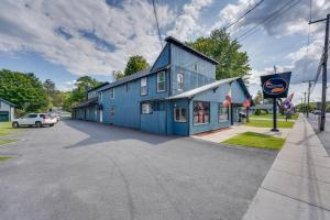 a blue building on the side of a street at Spacious Old Forge Condo w/ Patio & Fire Pit! in Old Forge