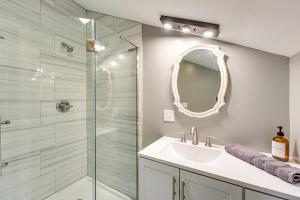 a bathroom with a shower and a sink and a mirror at Old Forge Studio Close to Lakes and Hiking Trails in Old Forge