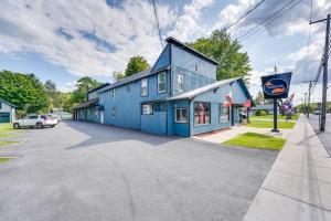 a blue building on the side of a street at Old Forge Studio Close to Lakes and Hiking Trails in Old Forge