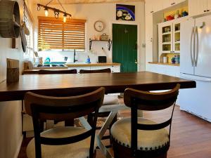 a kitchen with a large wooden table and chairs at Lookout Cabin in Prescott