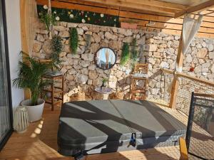 a room with a stone wall and a bed at La Vista in Drage +89 photos