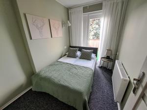En eller flere senge i et værelse på Twoja Przystań