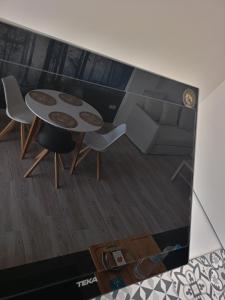 a view of a living room with a table and chairs at La Lunita in Valverde