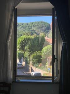 a window with a view of a mountain view at Well in Filettole