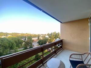 a balcony with a table and chairs and a view at Marina Walk Apartment in Vilamoura