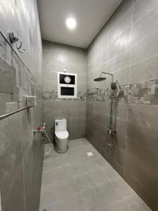 a bathroom with a shower and a toilet in it at شقق مفروشة للايجار صلالة - صحلنوت New Furnished Apartments for rent Salalah - Sahalnout in Sikun Shikfainot