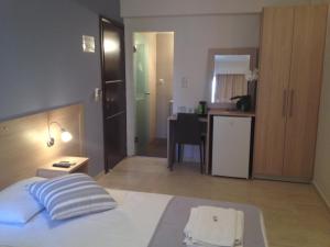 Postel nebo postele na pokoji v ubytování Apollon Hotel