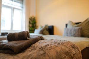 Ένα ή περισσότερα κρεβάτια σε δωμάτιο στο Napwell