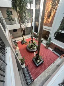 an image of a courtyard with palm trees in a building at Vigan Living in Vigan