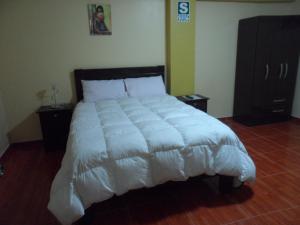 Postelja oz. postelje v sobi nastanitve Pachamama Hostel