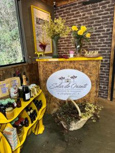 a sign for a tasting of wine on a table at Solar do Oriente - Yurt Ecovillage in São Joaquim