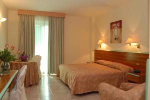 Hotel Parco degli Ulivi客房内的一张或多张床位