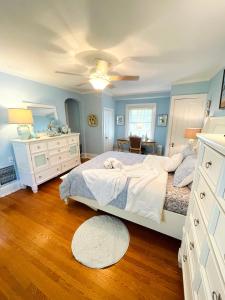 a bedroom with a bed and a dresser and a mirror at 9 Booth Lane in Haverford