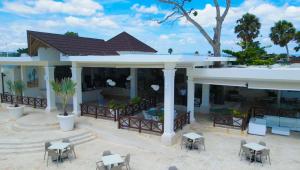 an aerial view of a house with tables and chairs at Sosua Ocean Village in Sosúa