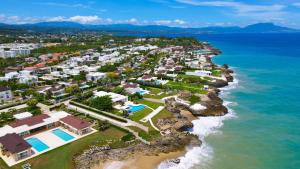 an aerial view of a resort near the ocean at Sosua Ocean Village in Sosúa
