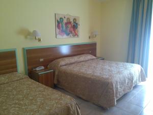 Hotel Parco degli Ulivi客房内的一张或多张床位
