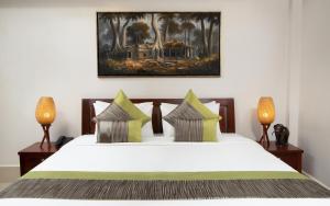Postel nebo postele na pokoji v ubytování Khemara Sovannphum Hotel