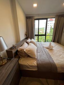 Postel nebo postele na pokoji v ubytování Marvest Condo Hua Hin for rent