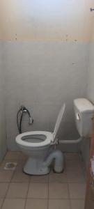 ห้องน้ำของ Sobey Laris Roomstay IMAN GMC