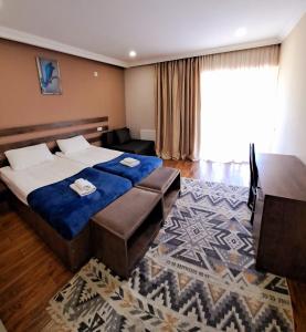 Postel nebo postele na pokoji v ubytování Hotel Mountain Mestia