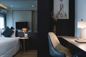 Postel nebo postele na pokoji v ubytování Qlosest Hotel
