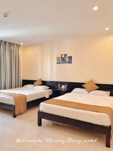 Ένα ή περισσότερα κρεβάτια σε δωμάτιο στο Tuần Châu - Phương Đông Motel Hạ Long