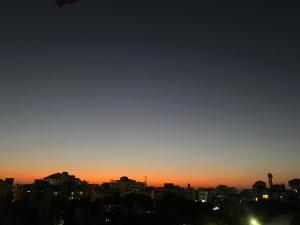 a view of a city skyline at sunset at Blue King in Jaipur