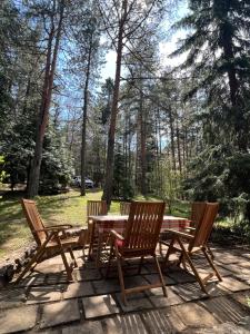 four chairs and a table on a patio at Tarushka house in Rača