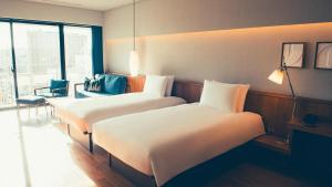 Katil atau katil-katil dalam bilik di Southwest Grand Hotel