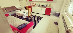a living room with a couch and a table at Apartman Delic in Lukavac