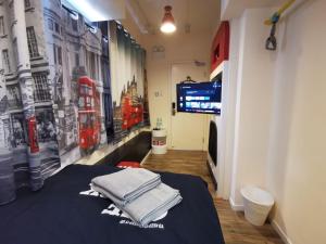 TV a/nebo společenská místnost v ubytování 香港九巴旅馆 KMB-Guesthouse + 24 fotografií