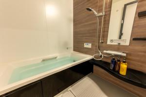 Bilik mandi di Irodori Hotel UGUISU