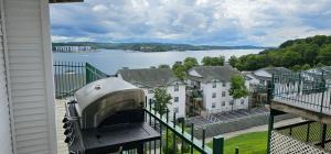 a balcony with a view of a body of water at Gourgeous lake views, amazing susets, on main channel in Lake Ozark